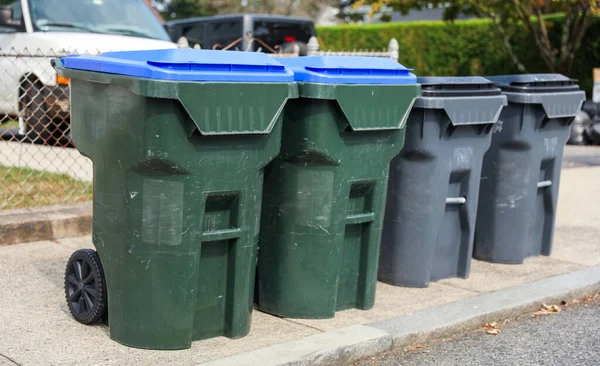 a collection of garbage cans