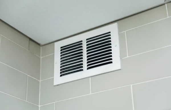 modern air filter on white wall in the house