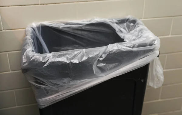 trash can in a trash bag, close up.