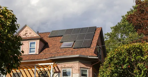 modern house on the roof of a house with a solar energy panel