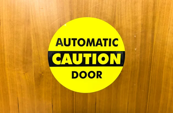 the door is a sign with a symbol of the attention