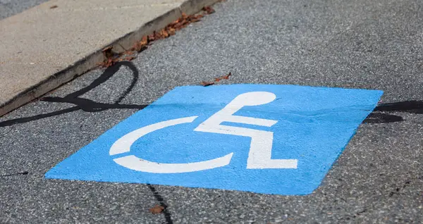 disabled person on parking sign