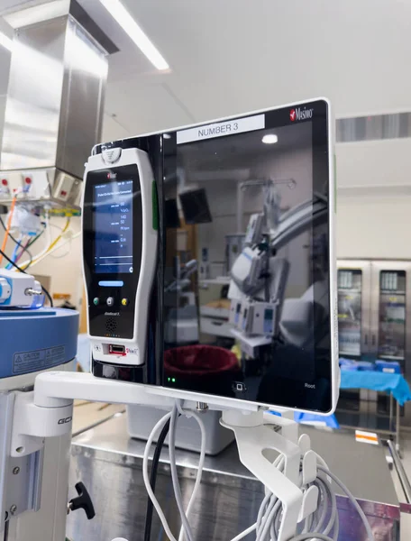 close - up of digital monitor with blood and monitor screen on table in modern operating room