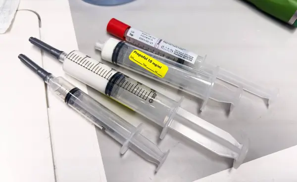 medical syringe, needle with a needle and a white background