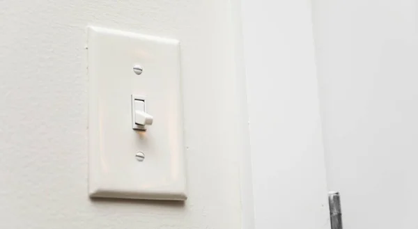 white switch on white wall