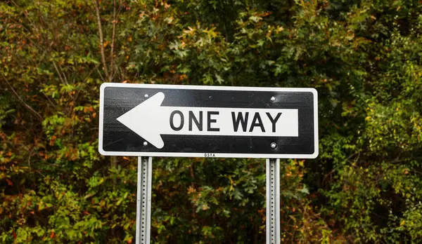 one way sign on the way