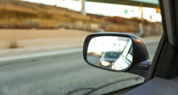 car mirror reflection in mirror.