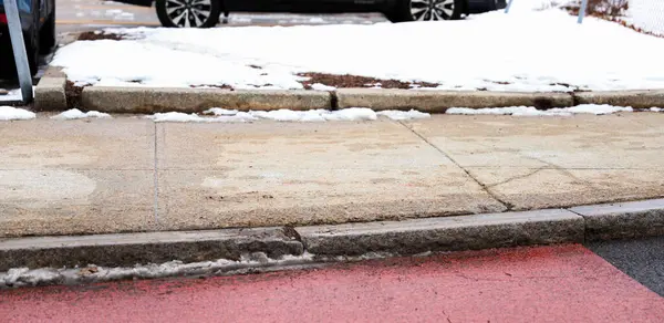 parking lot on a sidewalk in winter