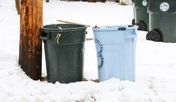 garbage bin in snow. trash can in winter
