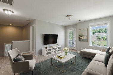 Kanepe ve sandalyeli modern oturma odasının içinde.