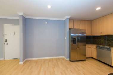 modern kitchen interior with blue walls and wooden floor