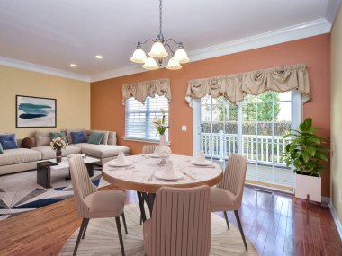 3 boyutlu, ahşap zeminli, 3 boyutlu tasarımı olan modern bir oturma odası.