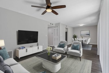 modern oturma odasının içi koltuk ve sandalyelerle dolu.