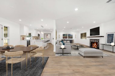 Oturma odası, masa ve sandalyeli yemek odası, kanepe ve şömine, modern tasarım. 3d oluşturma