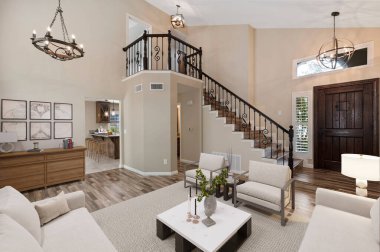 Oturma odasının içinde yemek odası, masa ve kanepe var. 3d oluşturma 