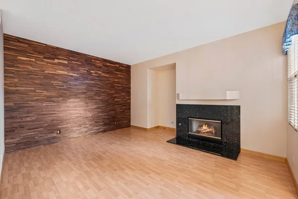 interior of a modern apartment with wooden floor and a fireplace