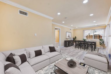 Masası ve sandalyeleri olan modern oturma odasının içinde. 3d oluşturma 