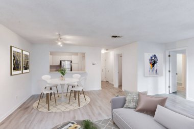 Modern oturma odasının içinde kanepe var. 3d oluşturma