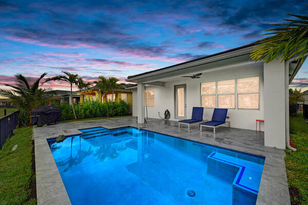 beautiful luxury swimming pool near new house. 3d rendering