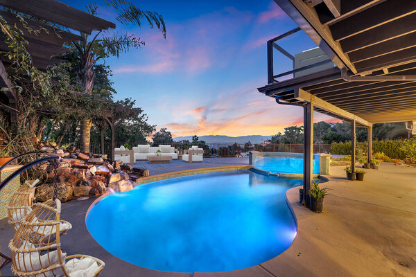 beautiful luxury swimming pool near new house. 3d rendering
