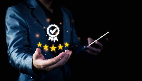 stock image The concept of providing a five-star premium service. businessman showing award High standards are guaranteed, service quality, business success, work efficiency, top quality assurance 5 stars.