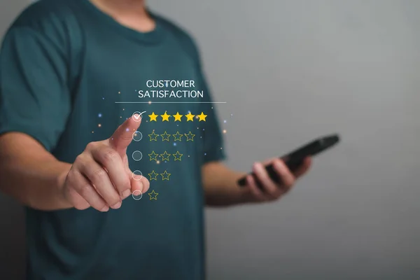 Customer satisfaction assessment concept. Customers are rating their satisfaction on virtual screen smartphone, rate five stars, good service, customer be happy, 5 star rating, excellent satisfaction.