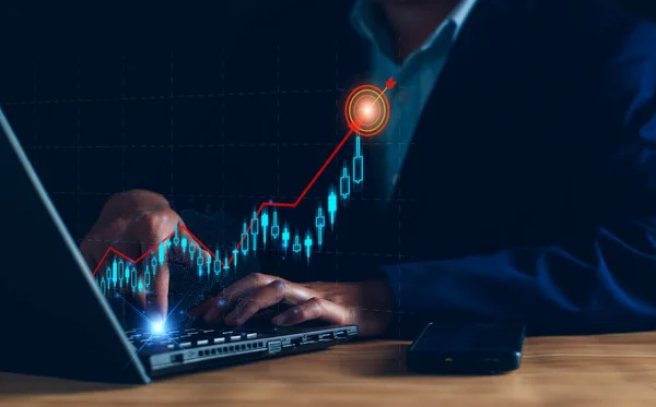 Business analysis, company profits. Businessman analyzing profit chart trends, making investment plans, trading stocks, economic trends, setting future goals. Analyze investment risks.