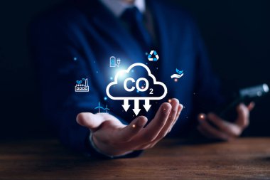 CO2 Karbondioksit emisyon azaltımı, iş adamı ve çevre teknolojisi ikonu, küresel ısınma, sürdürülebilir kalkınma, yenilenebilir enerji sektörü. iklim değişikliği, karbon yakalama, geri dönüşüm, yeniden kullanım