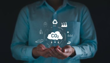 Sera gazı emisyon konseptini azalt. Karbon ayak izi iklim değişikliği ve sürdürülebilir. CO2 azaltımı, enerji tasarrufu, CO2 gazı emisyonunu azaltma, düşük sera gazı emisyonu, çevreyi koruma