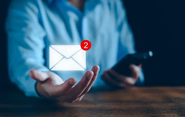 Email business marketing notification concept. Inbox receiving electronic message alert. Business email communication, digital marketing. business people touch on email in virtual screen technology.