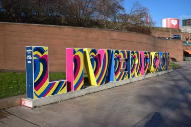 Liverpool, Merseyside, United Kingdom: Landmark Liverpool Sign located at Liverpool ONE shopping centre promoting the Eurovision Song Contest 2023 in support of Ukraine clipart