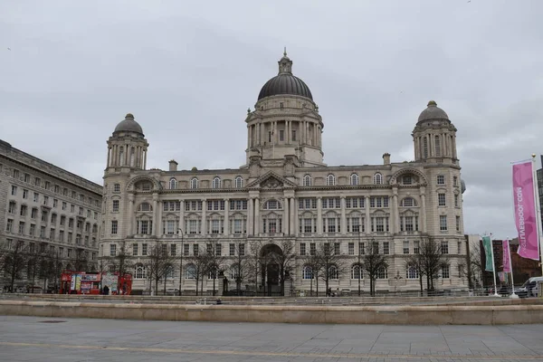 stock image Liverpool, Merseyside, United Kingdom - March 12 2023: Liverpool's iconic grade II* listed Port of Liverpool building, of the protected Three Graces, located at pier head along the Mersey riverfront