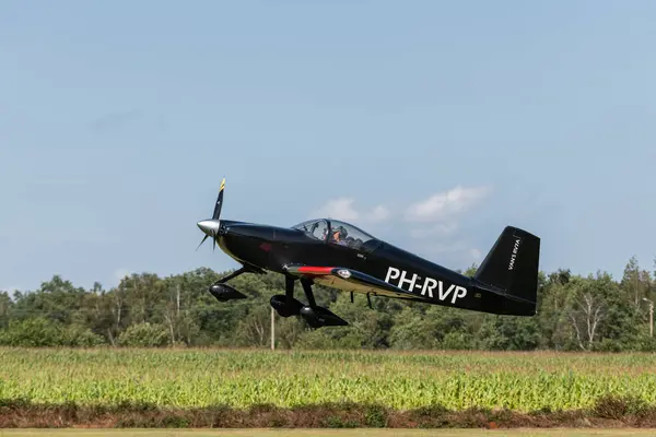 stock image View on airplane, sports propeller airplane taking at Kiewit airport with number Van's RV-7A. Private aircraft. Open house event organised by aero-Kiewit. 24  august 2024, Kiewit, Belgium.