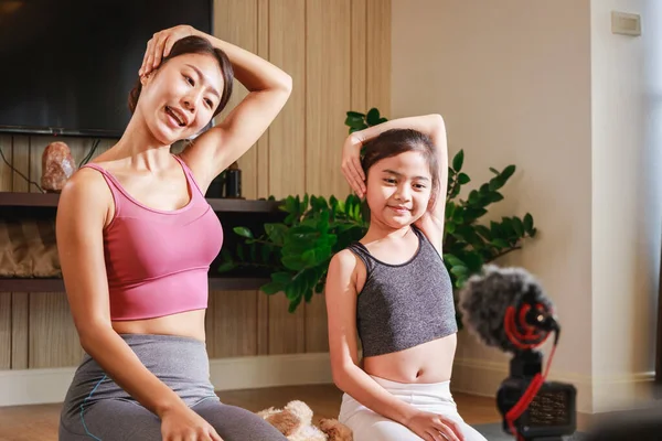 Experience the Joy of Family Yoga with an Asian Teacher and Girl\'s Virtual Clas