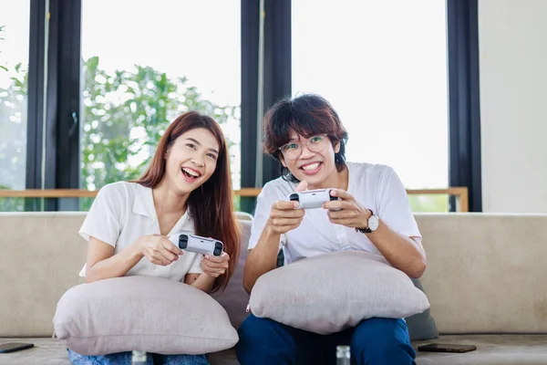 Gaming Together, Happy Couple Having Fun Playing Video Games in Living Room