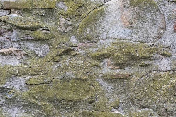 Mossige Stenen Muur Getextureerde Rood Getinte Wand Oneffen Oppervlak — Stockfoto