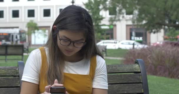 Woman Texting Distracted Park Bench — Stock Video