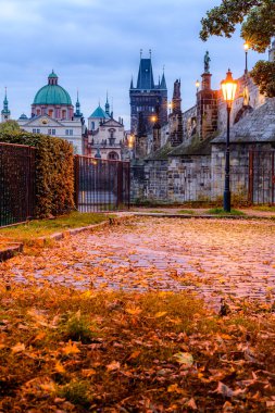 An autumn morning at the Charles Bridge in the historic center of Prague.  clipart