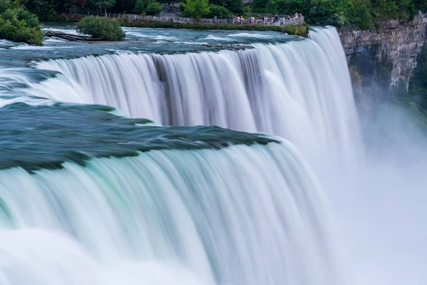 stock image A long exposure photo of the American - Canadian waterfalls Niagara Falls in the evening.