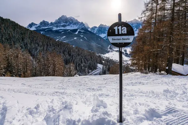 Ski slope sign in the Three Peaks (Drei Zinnen) ski resort in the UNESCO World Heritage site Dolomites in Italy.