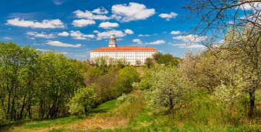 The UNESCO world heritage site Benedictine monastery Pannonhalma Archabbey in Hungary in early spring. clipart