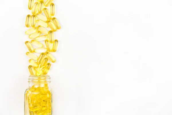 Yellow Soft Gel Oil Capsules Spilled Out Glass Bottle White — Stock Photo, Image