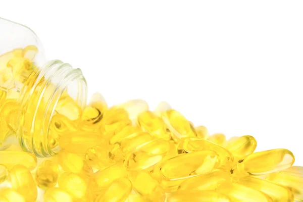 Żółte Miękkie Żelowe Pigułki Wylewające Się Szklanej Butelki Odizolowanej Białym — Zdjęcie stockowe