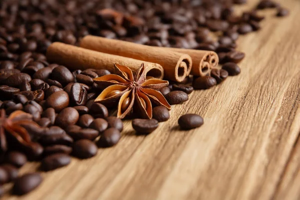 Coffee and spices background. Coffee beans with star anise and cinnamon, close-up shot