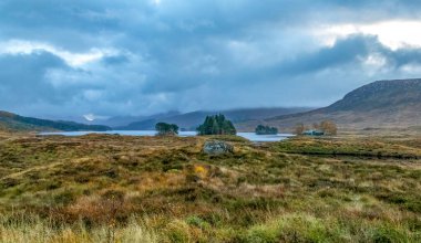 View of Loch Onich, Corrour, in remote Scotland with stormy sky clipart