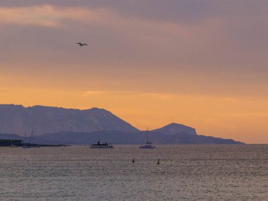 Sunset on Tavolara Island in Sardinia, Italy clipart