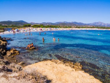 Budoni, Italy - August 2. 2023: People on Sant'Anna Beach. clipart