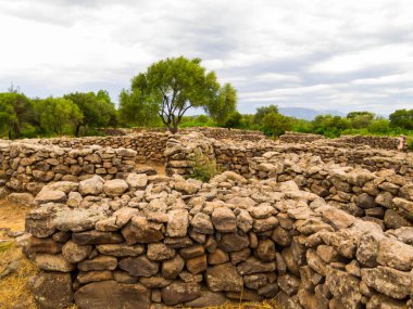 View of the ruins of the ancient Nuragic Complex of Serra Orrios in the Province of Nuoro in Sardinia, Italy clipart