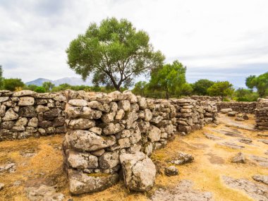 View of the ruins of the ancient Nuragic Complex of Serra Orrios in the Province of Nuoro in Sardinia, Italy clipart