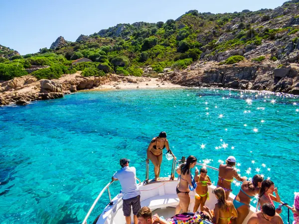 stock image Molara Island, Italy - August 8, 2023: Tourist boat visiting amazing beach.
